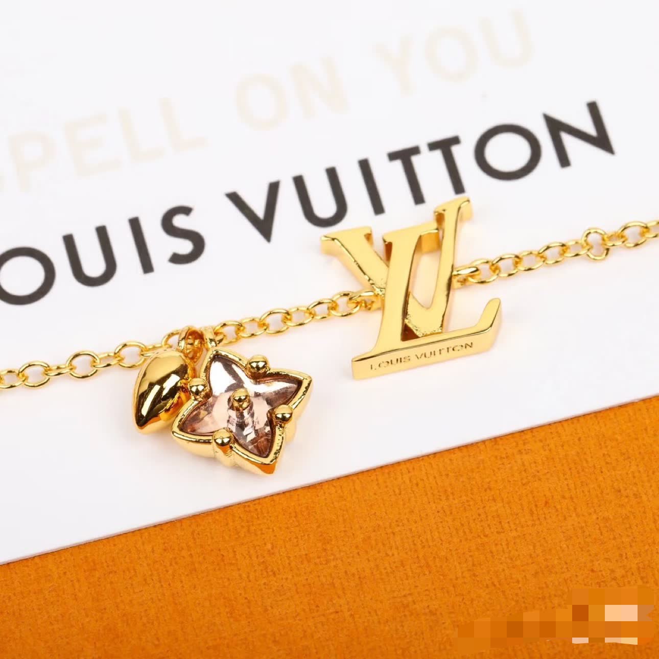 Louis Vuitton Gold Tone Bracelet with Charms